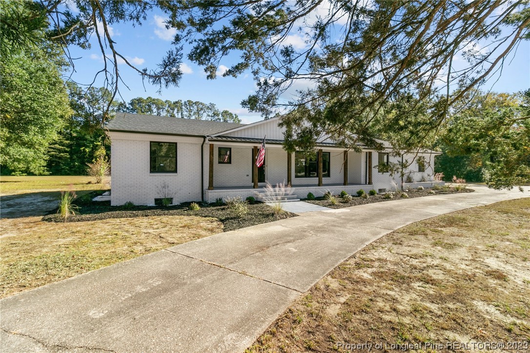 4659 Tabor Church Road Fayetteville, NC 28312 - Photo 3 of 50 a view of a house with snow on the road