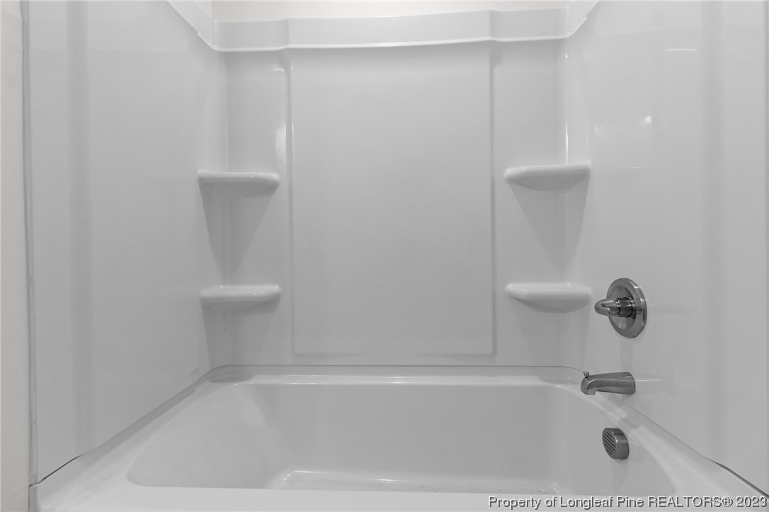 4659 Tabor Church Road Fayetteville, NC 28312 - Photo 36 of 50 a bathroom with a bathtub
