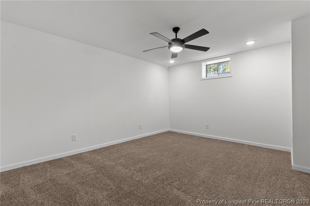 4659 Tabor Church Road Fayetteville, NC 28312 - Photo 38 of 50 an empty room with a window and a fan