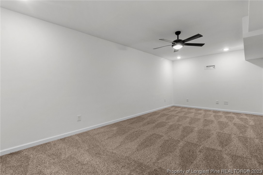 4659 Tabor Church Road Fayetteville, NC 28312 - Photo 40 of 50 an empty room with a empty space and a ceiling fan