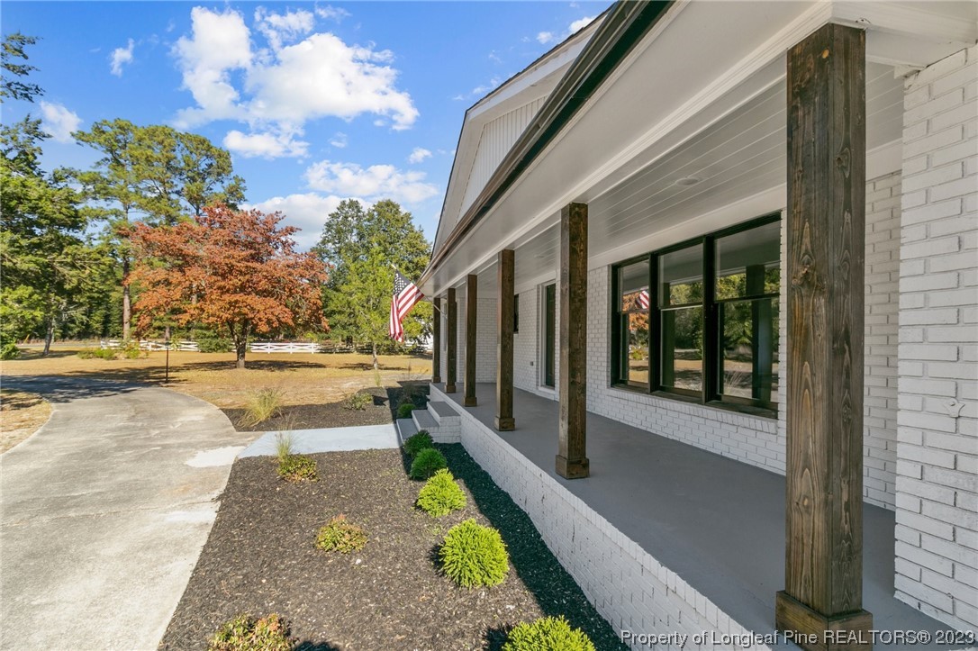 4659 Tabor Church Road Fayetteville, NC 28312 - Photo 4 of 50 a view of a house with a yard