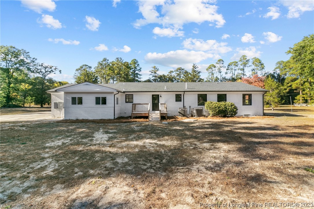 4659 Tabor Church Road Fayetteville, NC 28312 - Photo 41 of 50 a view of a house with a chairs in patio