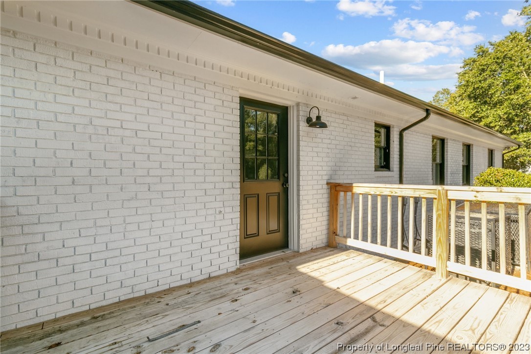 4659 Tabor Church Road Fayetteville, NC 28312 - Photo 45 of 50 a view of a wooden deck