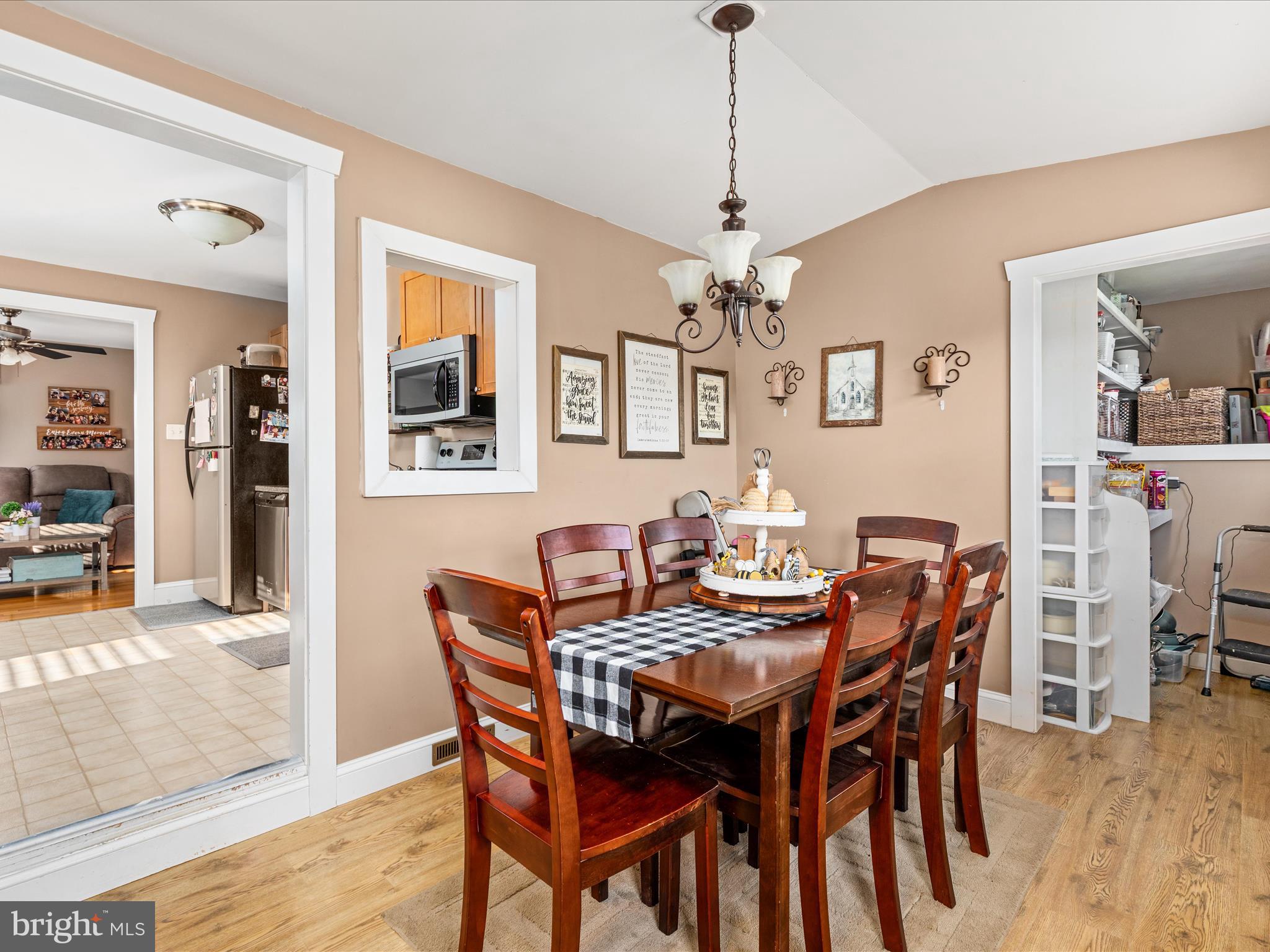 702 Braxton Road Front Royal, VA 22630 - Photo 15 of 61 a view of a dining room with furniture and wooden floor