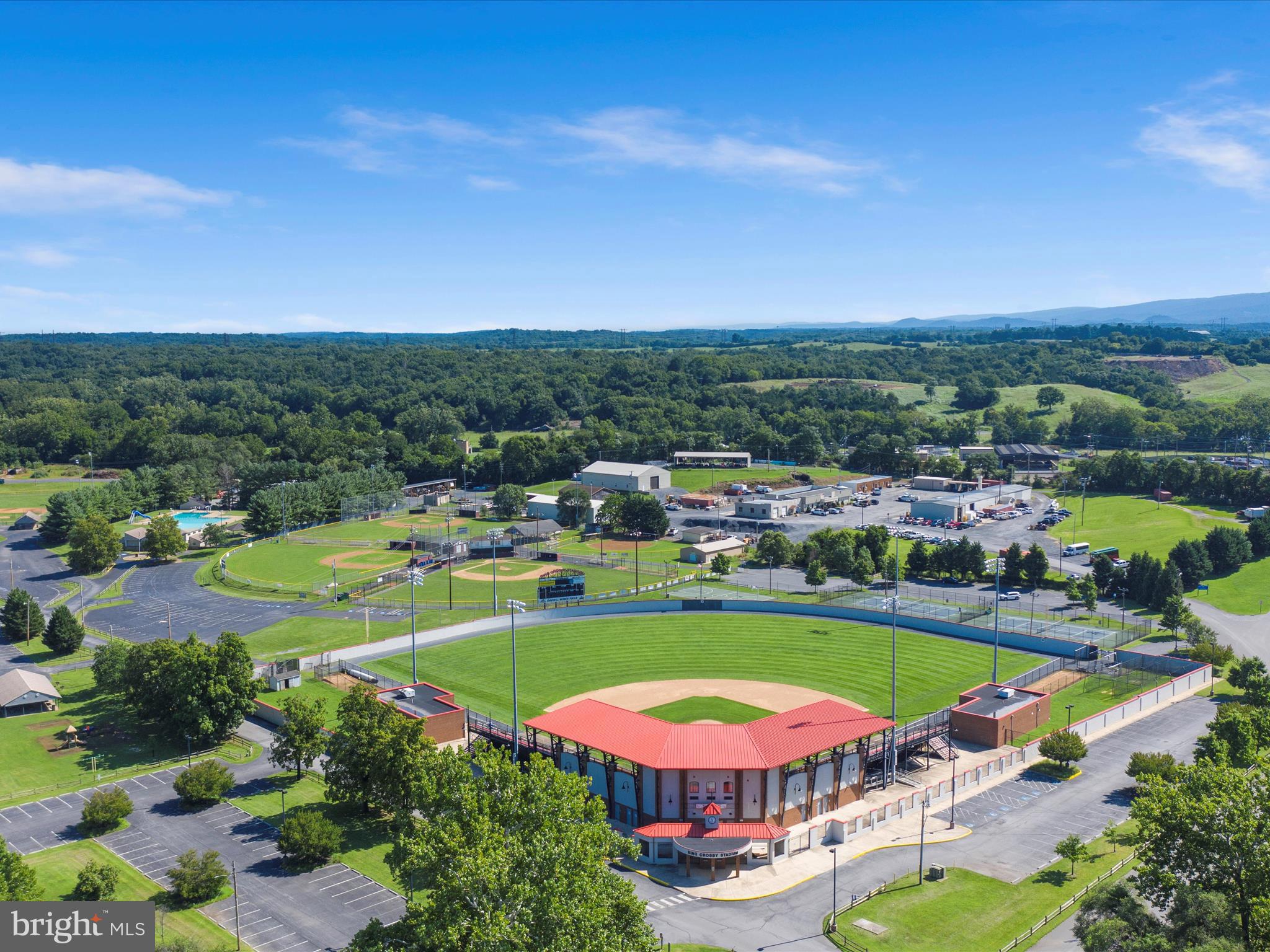 702 Braxton Road Front Royal, VA 22630 - Photo 58 of 61 an aerial view of a swimming pool a playground lake and mountain view in back