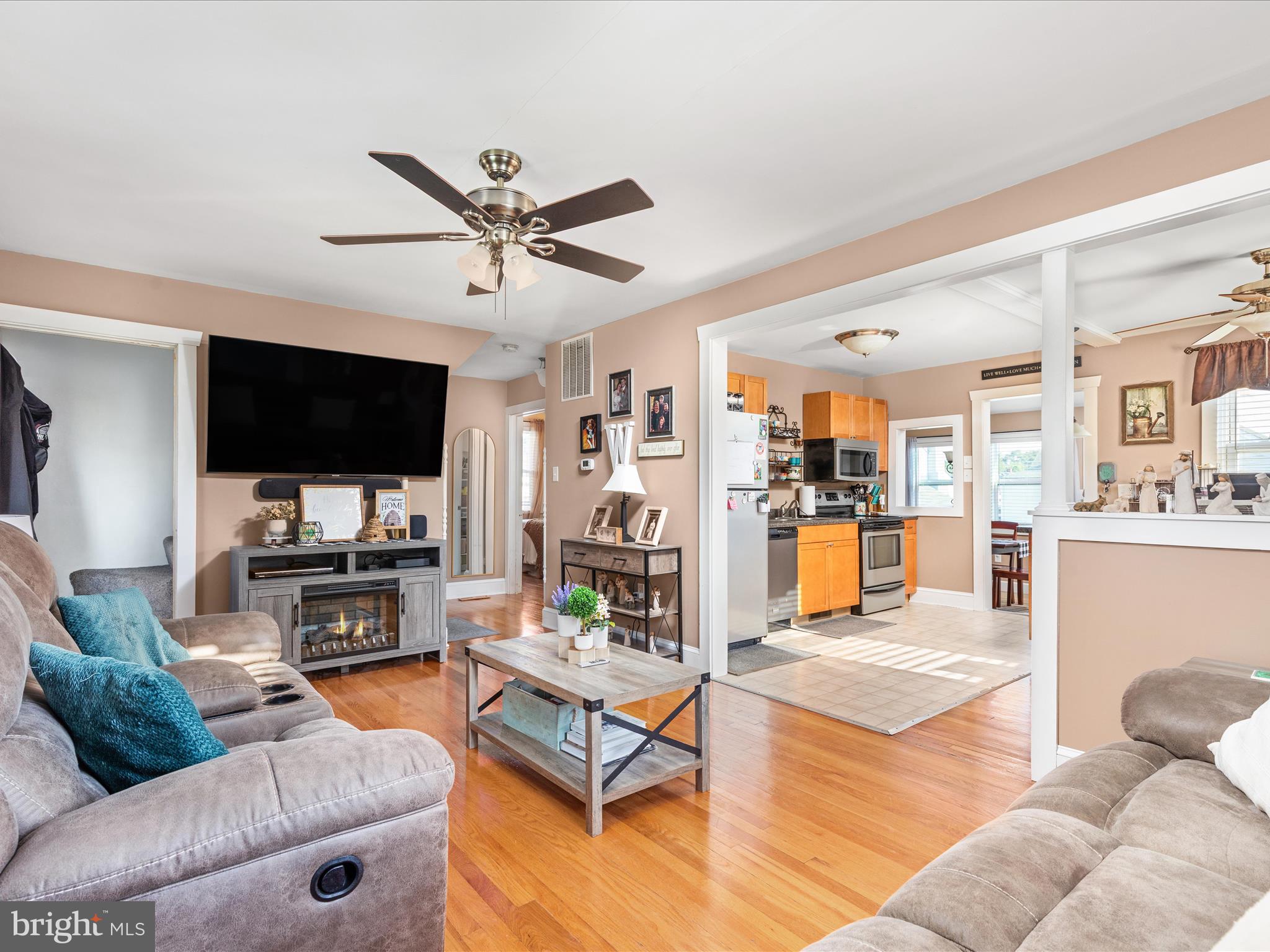 702 Braxton Road Front Royal, VA 22630 - Photo 6 of 61 a living room with furniture and a flat screen tv with kitchen view