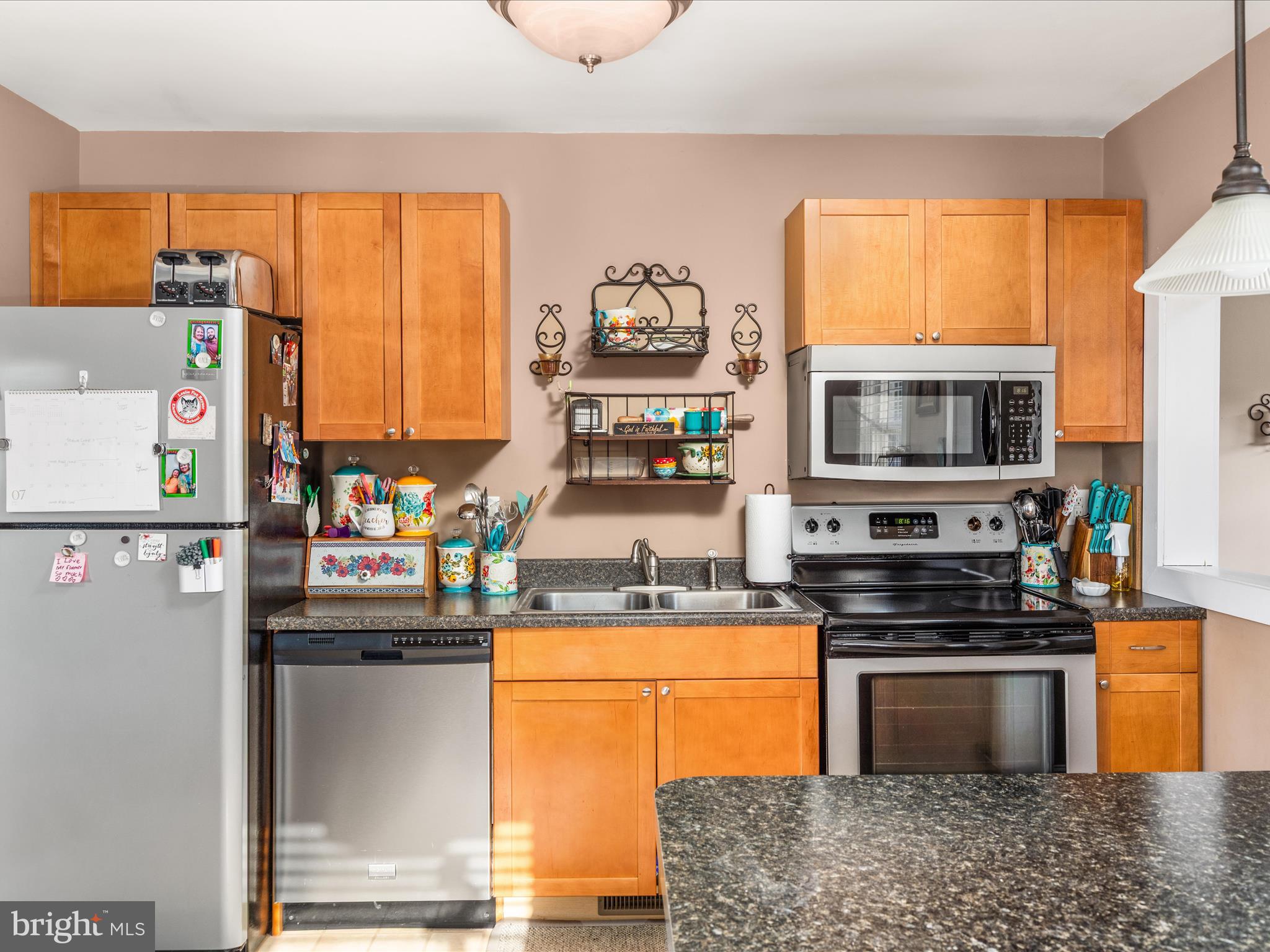 702 Braxton Road Front Royal, VA 22630 - Photo 10 of 61 a kitchen with stainless steel appliances granite countertop a stove a sink and a microwave