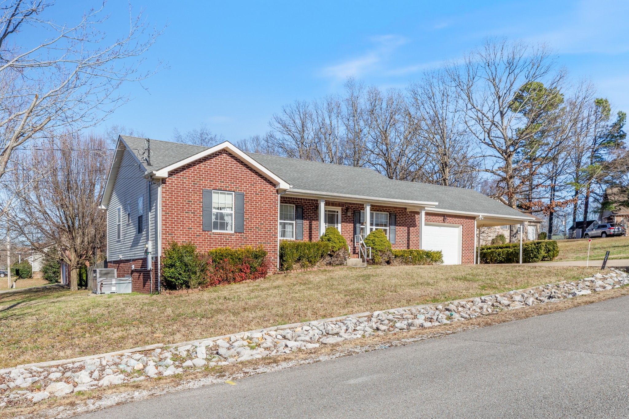101 Garden View Court Dickson, TN 37055 - Photo 1 of 33 a front view of a house with a garden
