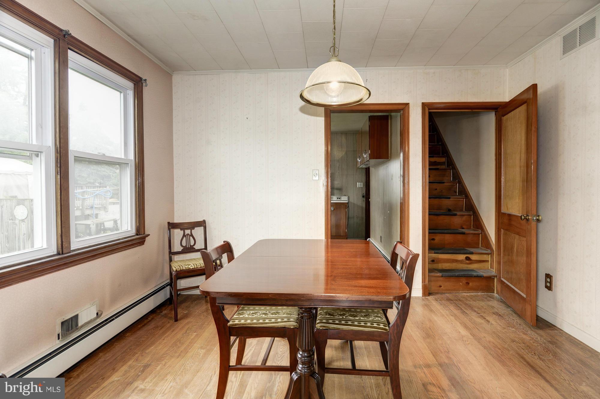 307 Charles Road Linthicum, MD 21090 - Photo 4 of 30 a view of a dining room with furniture window and wooden floor