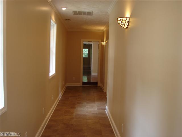 1177 Pullman Drive Rural Hall, NC 27045 - Photo 15 of 16 Other. Long Tiled Hallway
