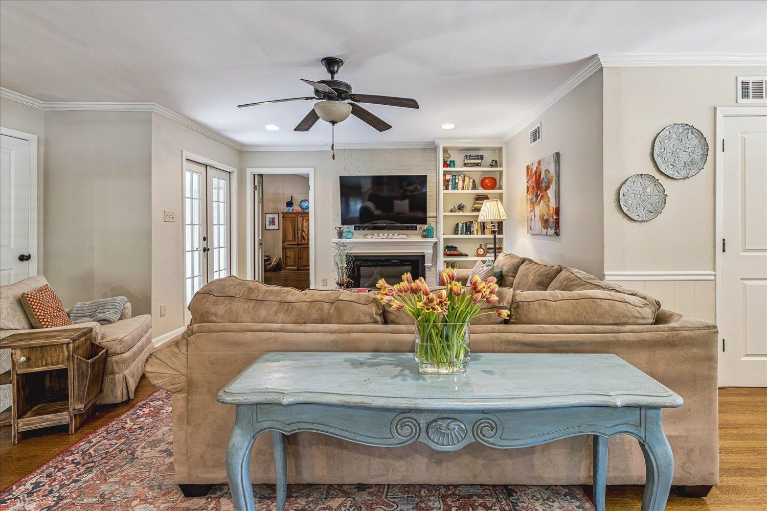 4220 Minden Road Memphis, TN 38117 - Photo 9 of 30 a living room with fireplace furniture and a flat screen tv