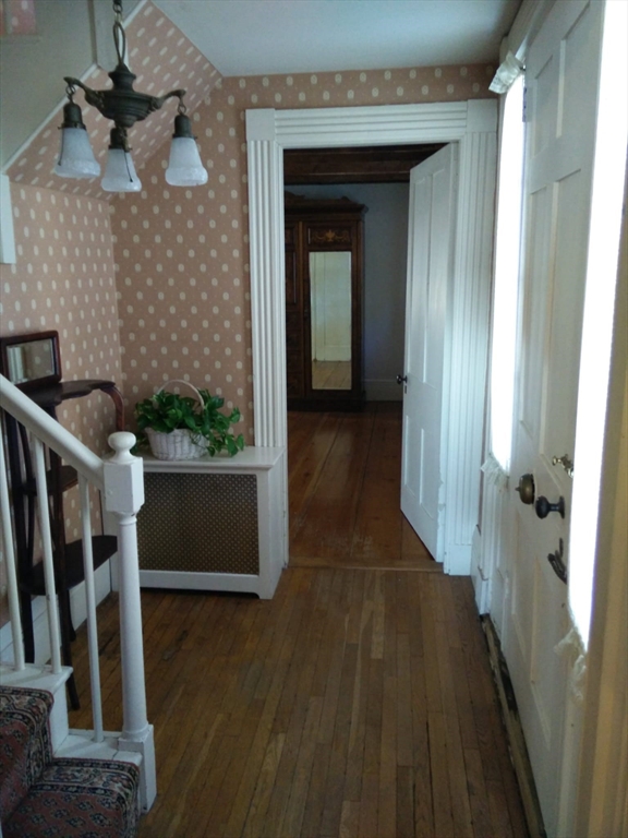 331 South Main Street Andover, MA 01810 - Photo 3 of 6 a view of a hallway with wooden floor and stairs