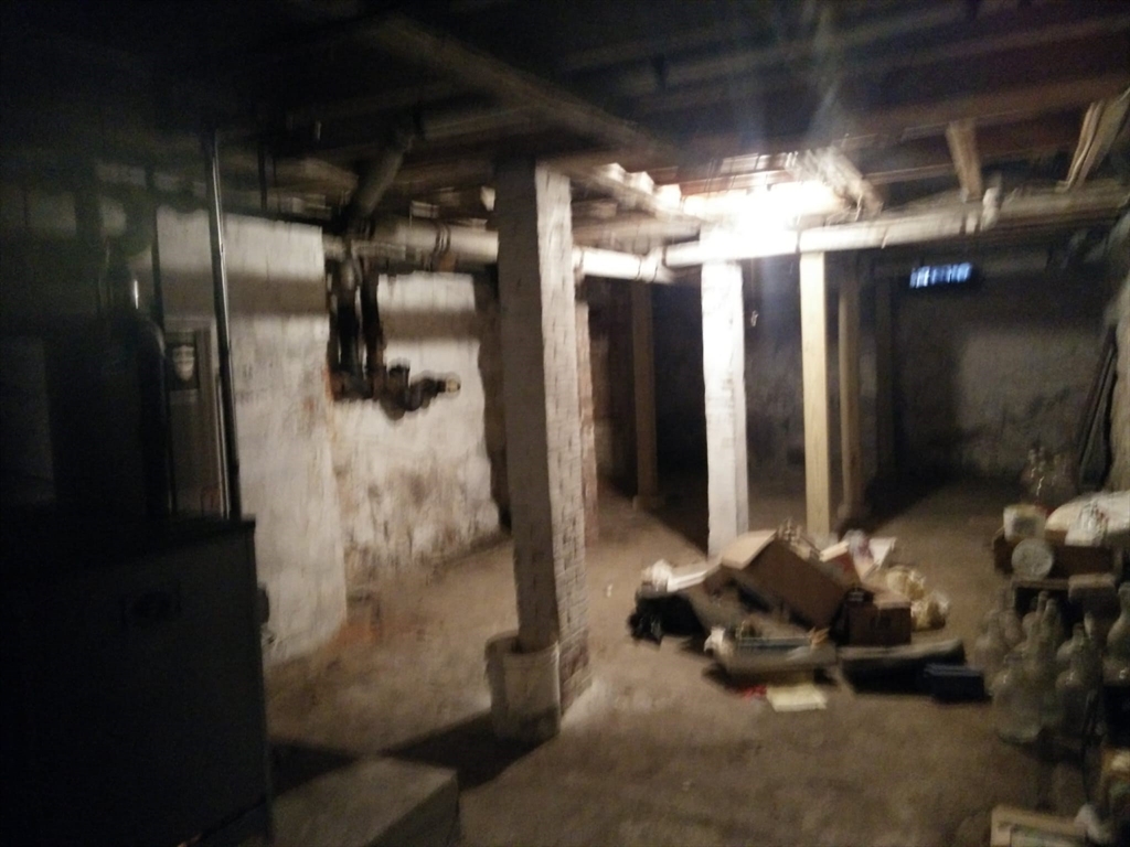 331 South Main Street Andover, MA 01810 - Photo 6 of 6 a room with water heater and wooden cabinets