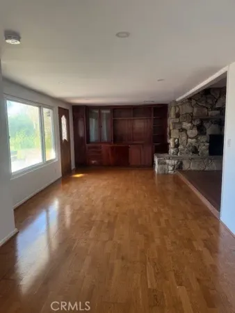 a view of a livingroom with furniture and window