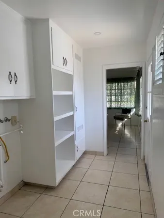 a view of a closet area with living room