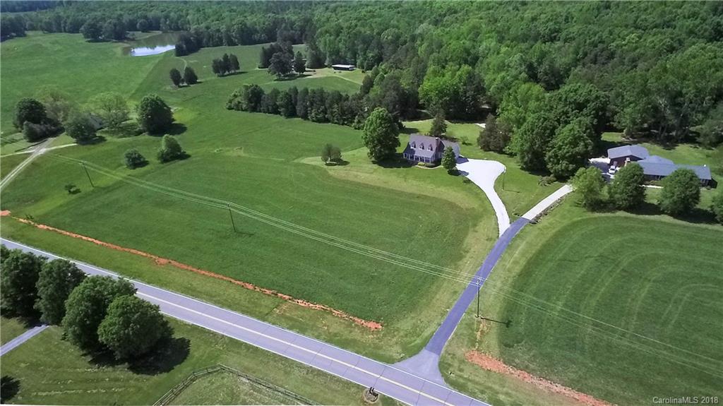 9049 Stacy Howie Road Indian Land, SC 29707 - Photo 3 of 36 a view of a golf course with a garden