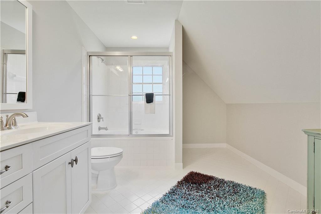 9049 Stacy Howie Road Indian Land, SC 29707 - Photo 26 of 36 a bathroom with a sink a toilet and shower