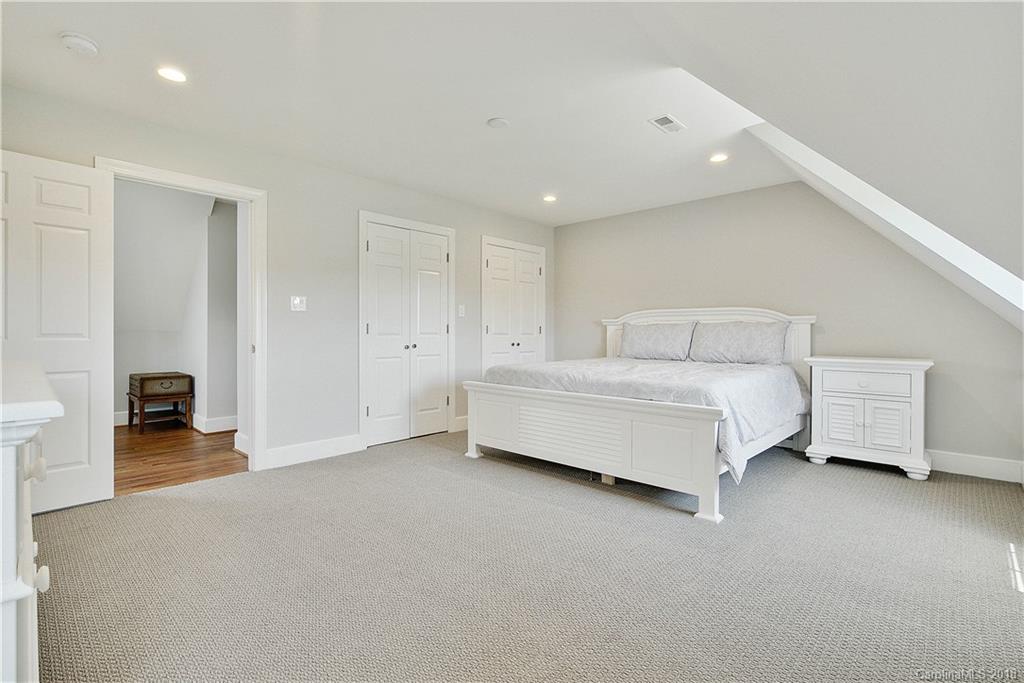 9049 Stacy Howie Road Indian Land, SC 29707 - Photo 27 of 36 a bedroom with bed and a couch