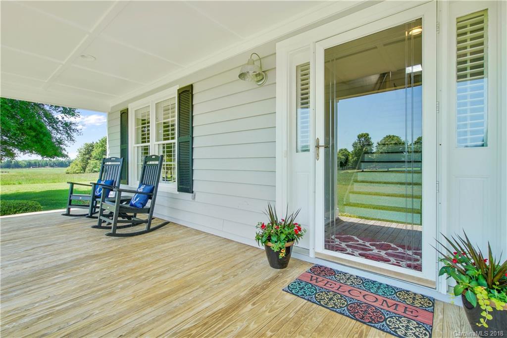 9049 Stacy Howie Road Indian Land, SC 29707 - Photo 4 of 36 a sitting area with furniture and garden view
