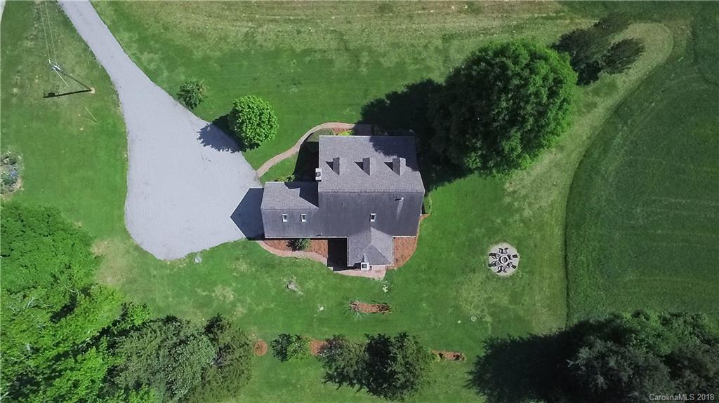 9049 Stacy Howie Road Indian Land, SC 29707 - Photo 34 of 36 an aerial view of a house with garden space and street view