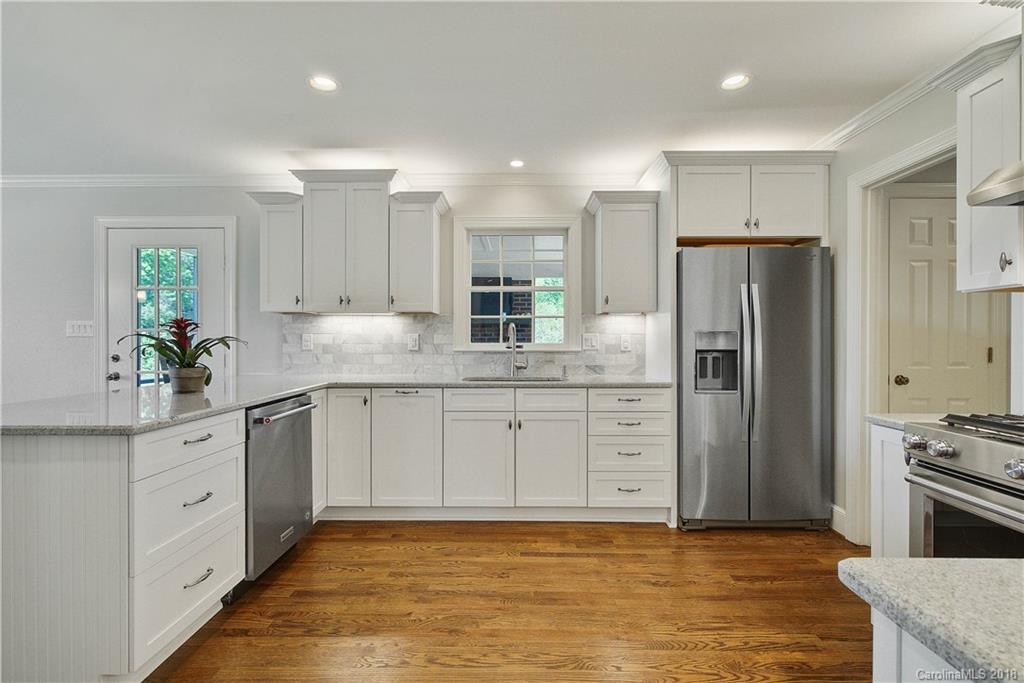 9049 Stacy Howie Road Indian Land, SC 29707 - Photo 10 of 36 a kitchen with stainless steel appliances granite countertop a refrigerator sink and cabinets