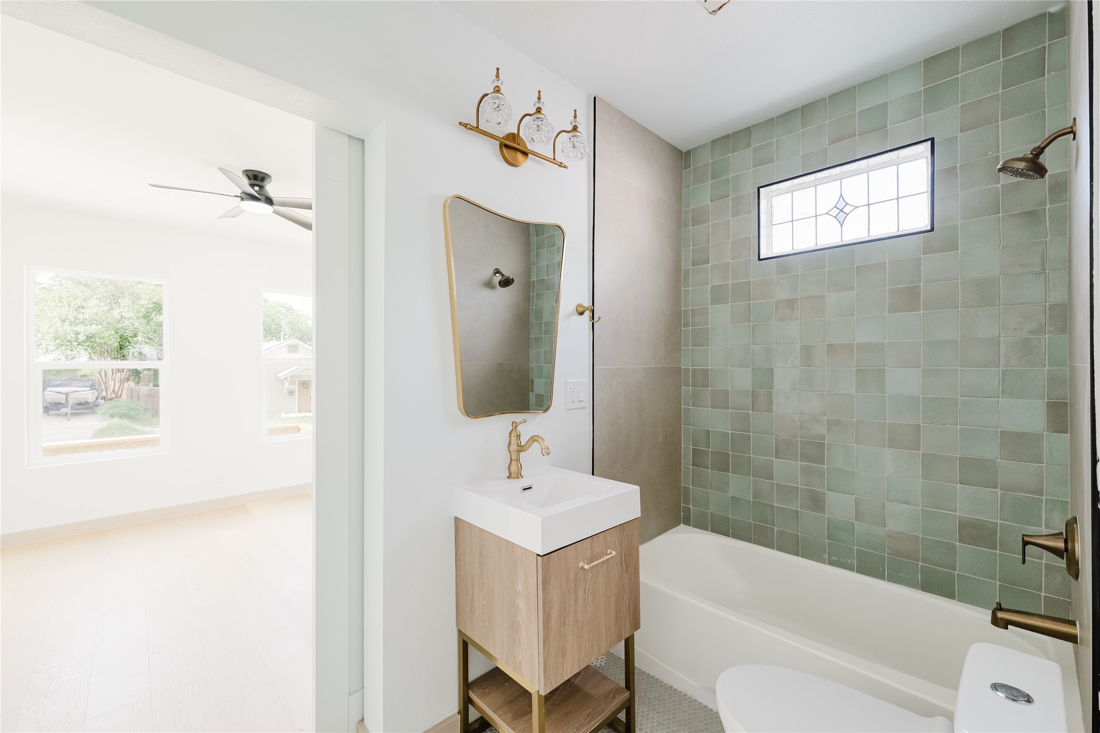 1907 East 21st Street Austin, TX 78722 - Photo 19 of 31 Full bathroom featuring vanity and shower/tub combination