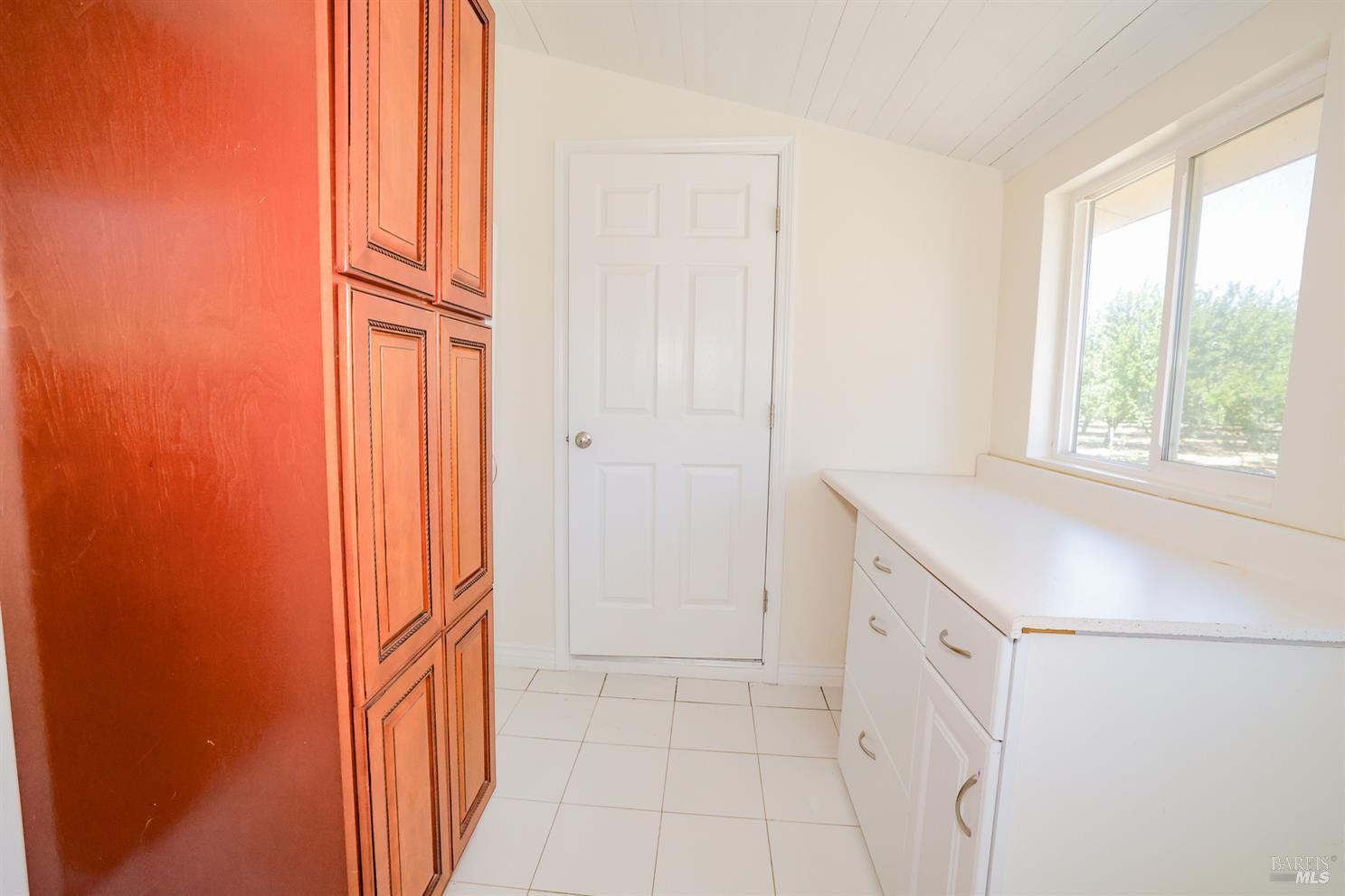7948 North Meridian Road Dixon, CA 95620 - Photo 30 of 59 an entryway with wooden floor and cabinet