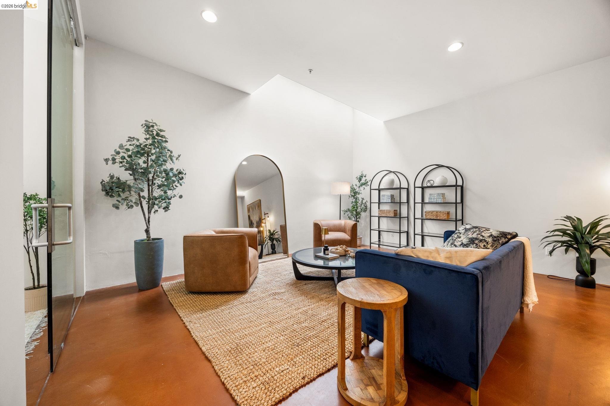 2709 Tenth Street, Unit D Berkeley, CA 94710 - Photo 8 of 29 Vaulted ceilings, recessed lighting, and a glass-paneled door