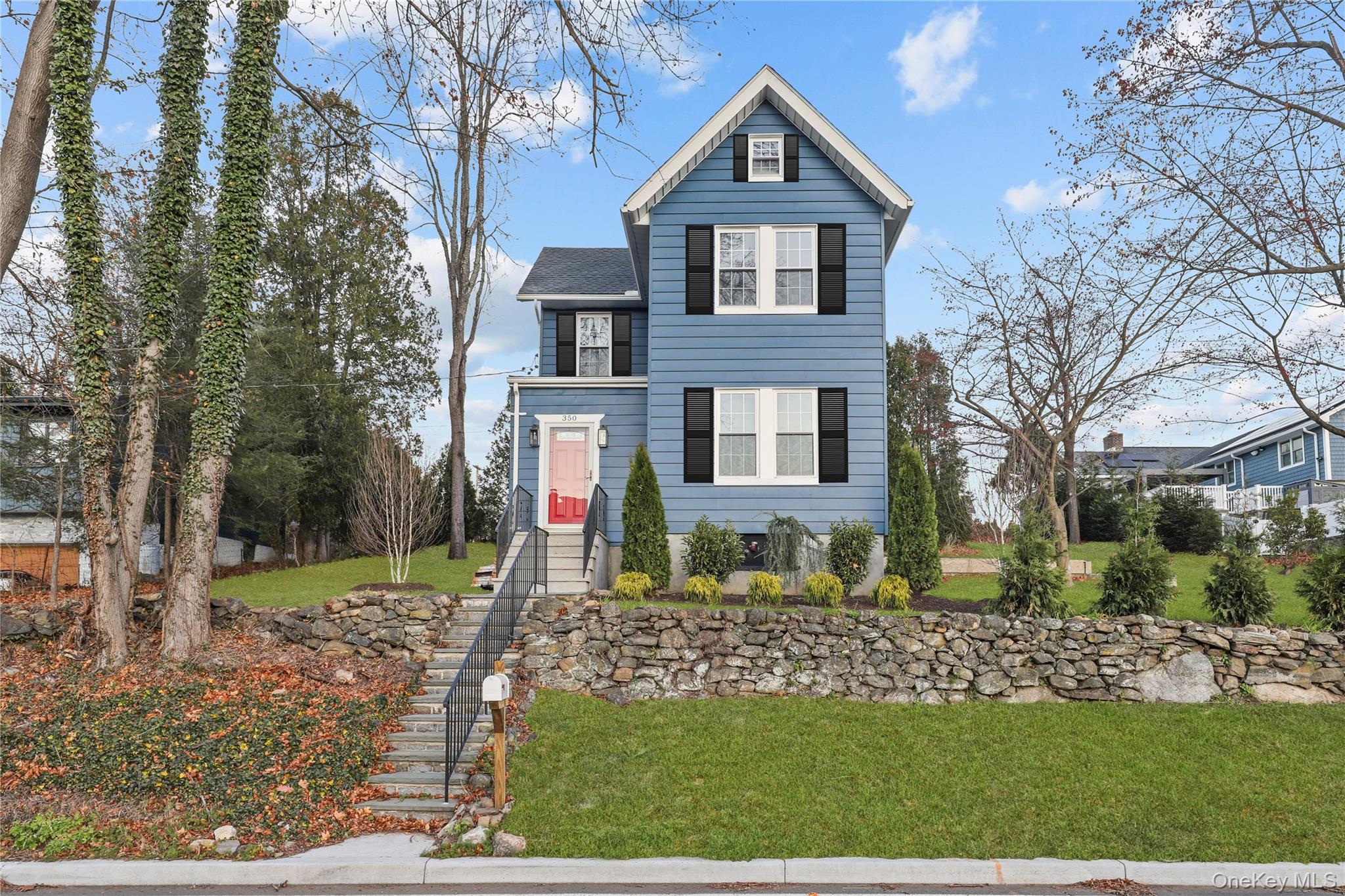 a front view of a house with a yard
