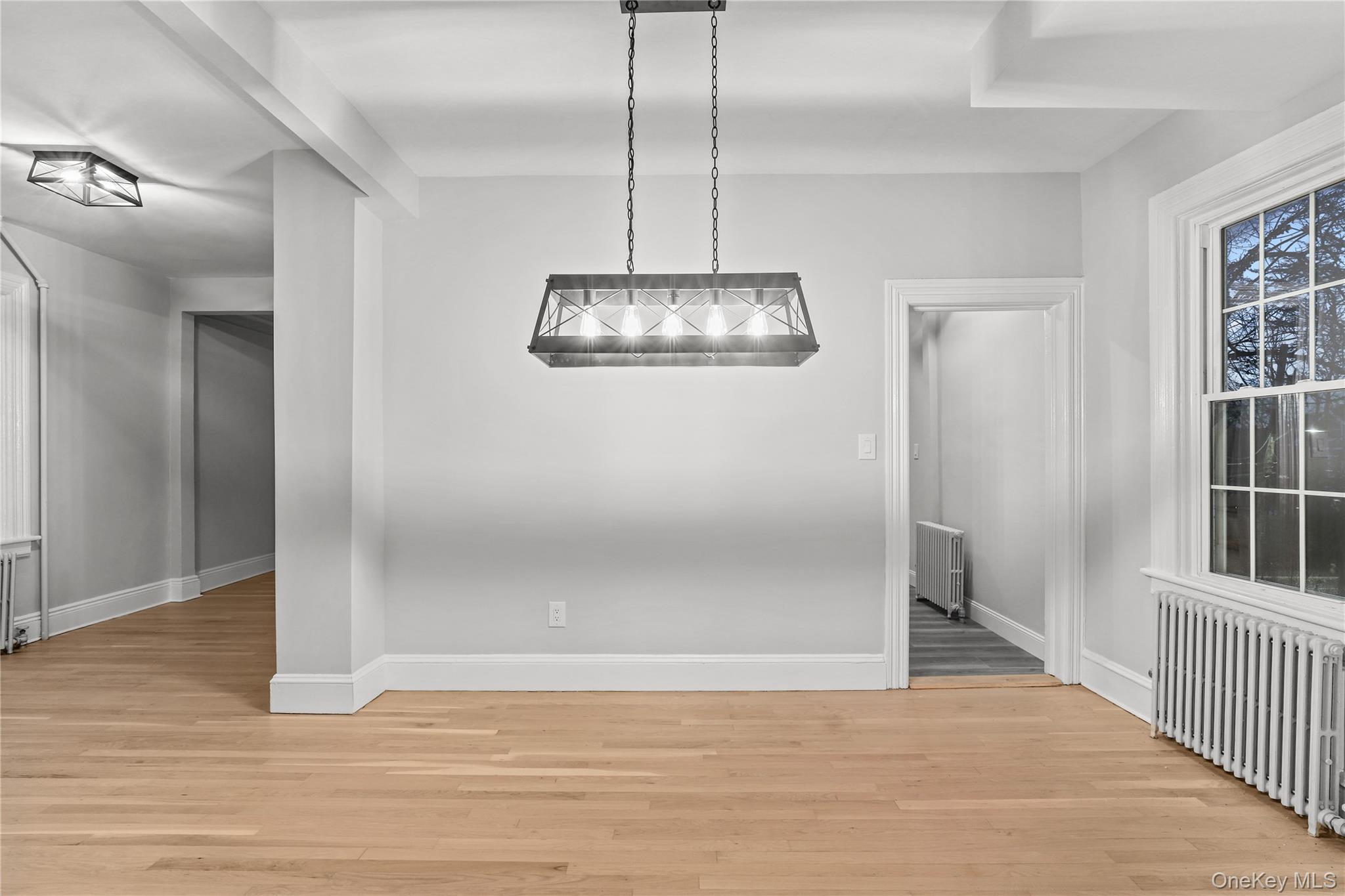 350 Commerce Street Hawthorne, NY 10532 - Photo 12 of 22 an empty room with wooden floor and windows