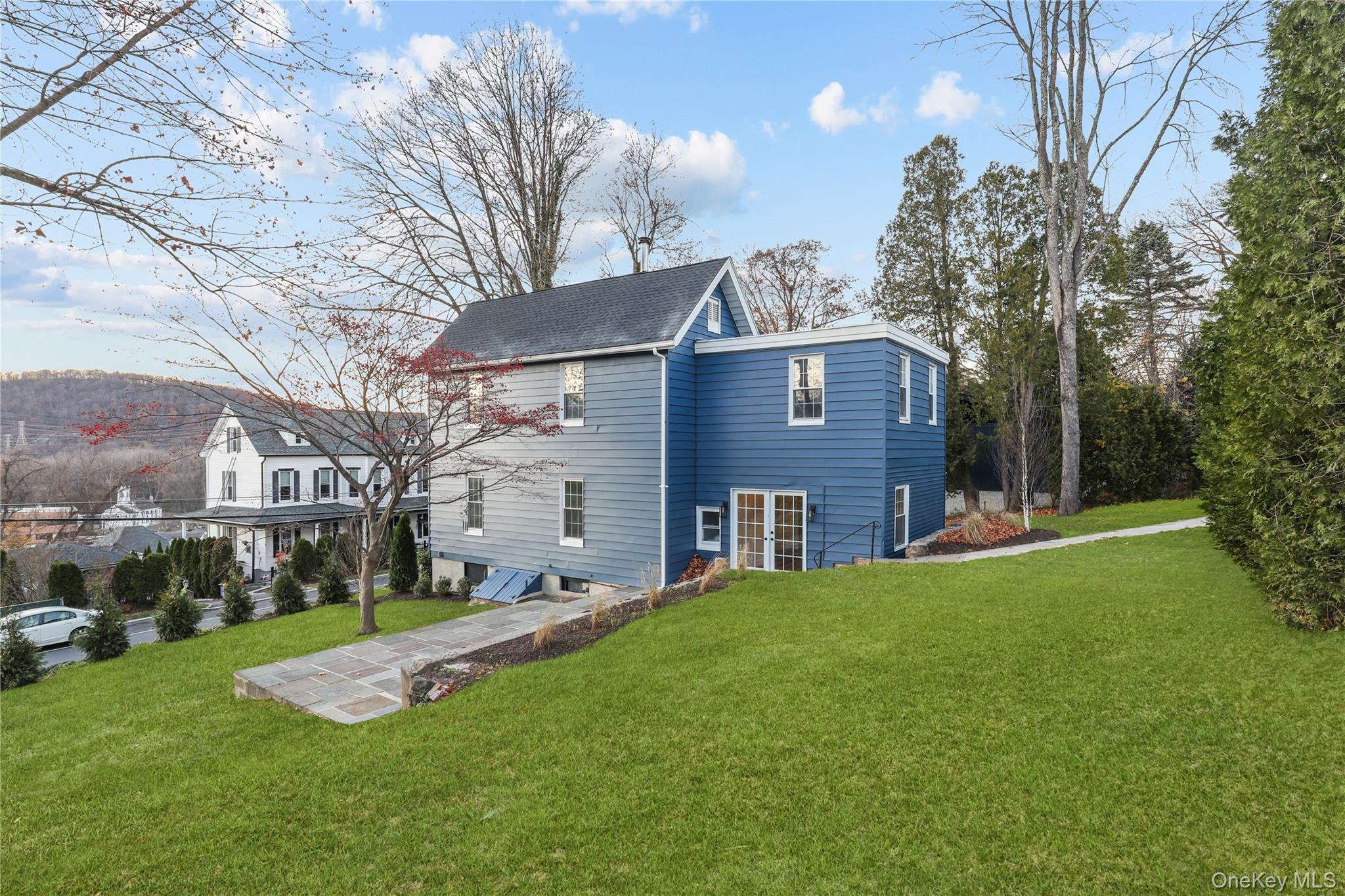 350 Commerce Street Hawthorne, NY 10532 - Photo 6 of 22 a view of a house with a yard porch and sitting area