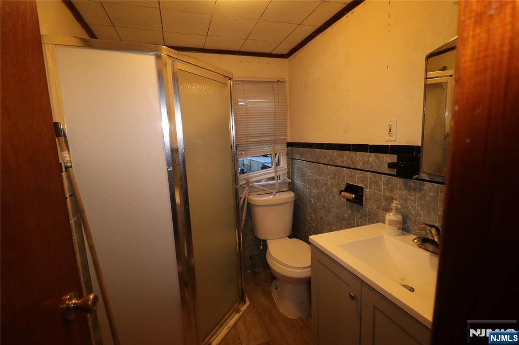 233-235 Adams Street Newark, NJ 07105 - Photo 16 of 20 a bathroom with a sink and toilet