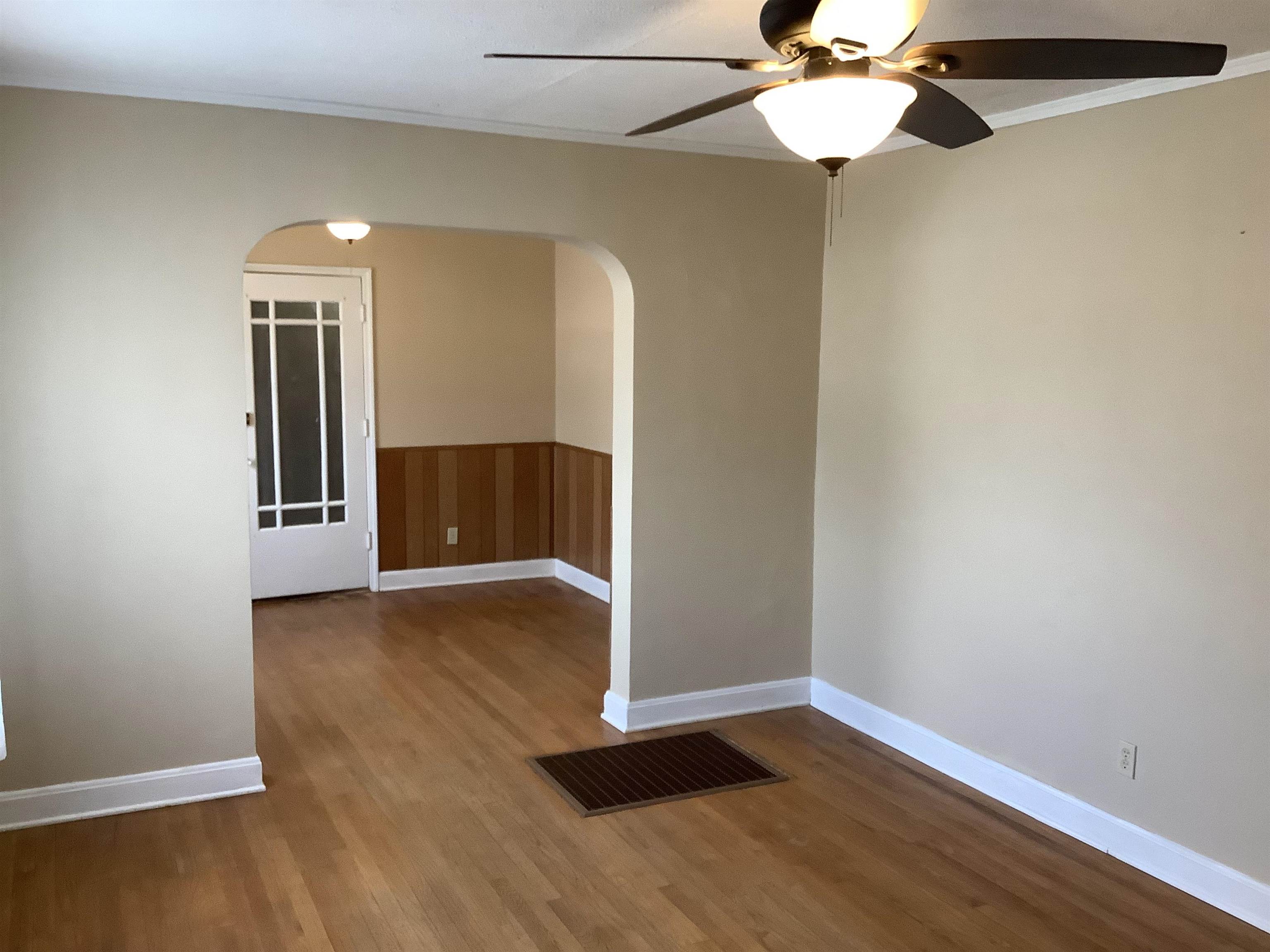 4153 Lawrence Road Memphis, TN 38122 - Photo 3 of 13 a view of an empty room with wooden floor