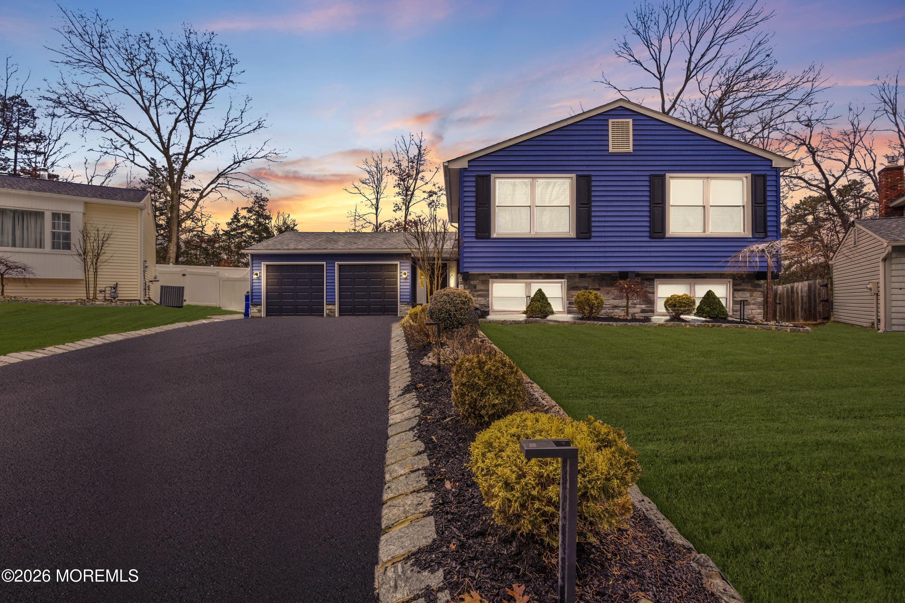 a front view of a house with a yard