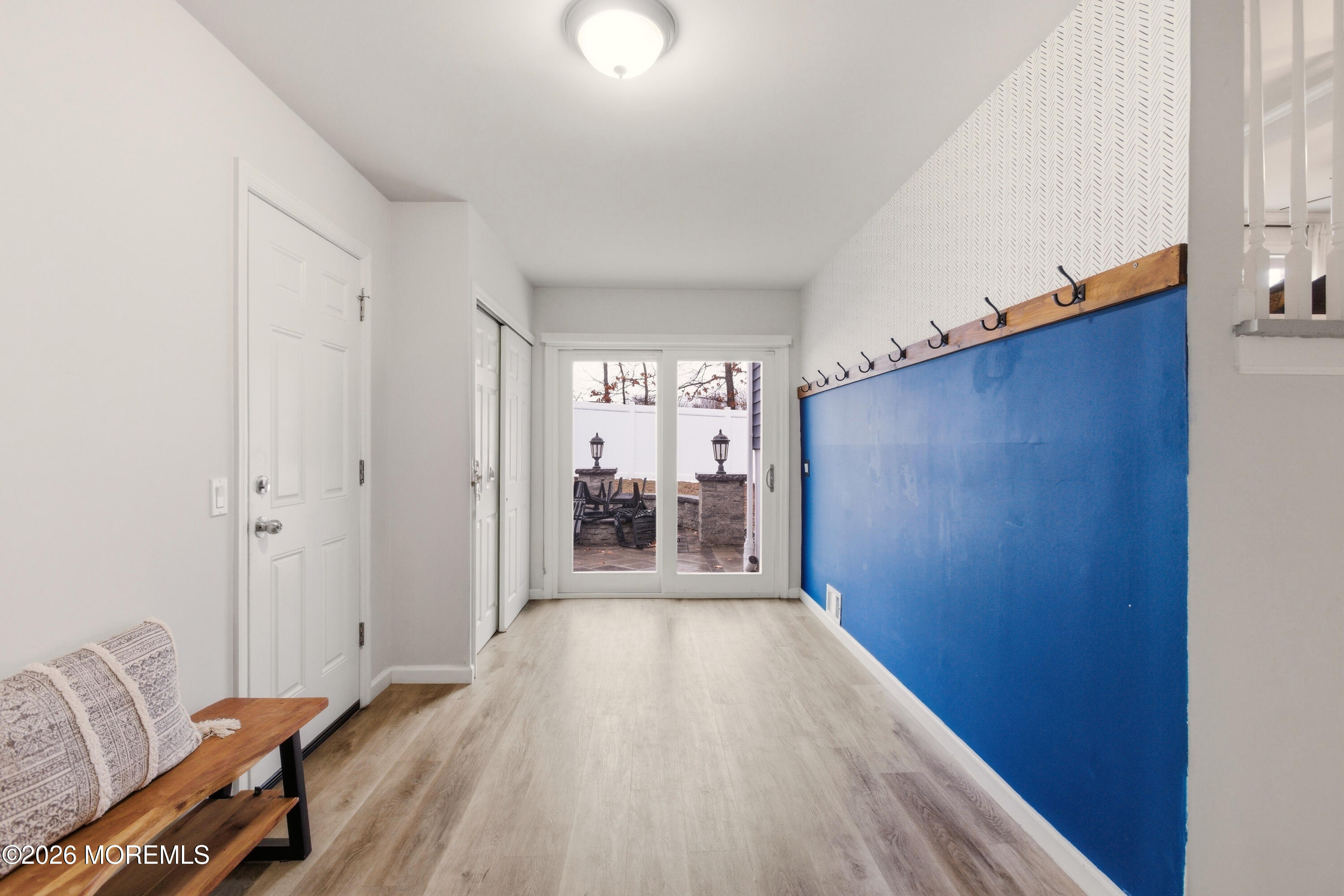 19 Silversmith Court Howell, NJ 07731 - Photo 12 of 48 a view of a hallway with wooden floor and furniture