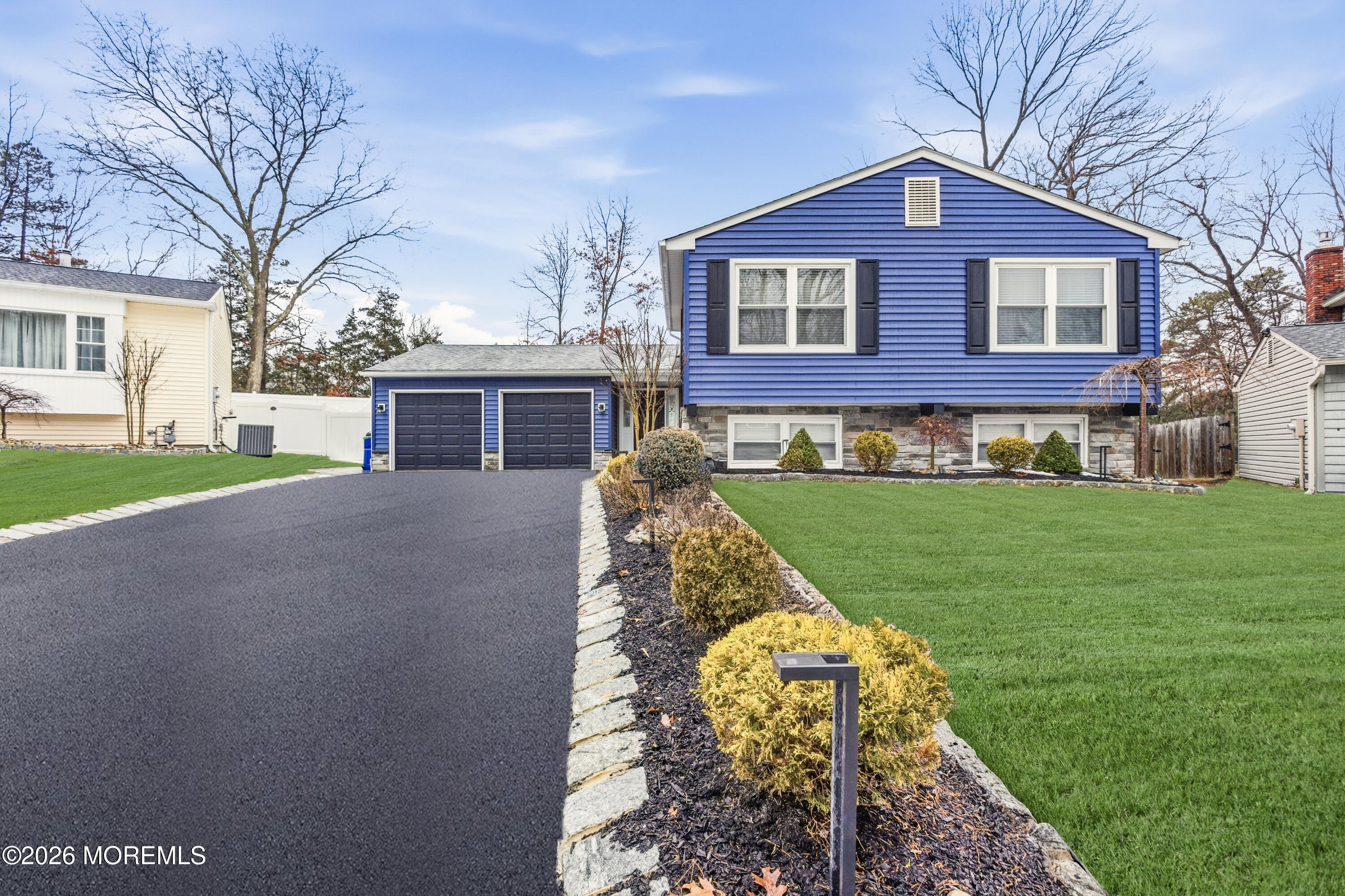 19 Silversmith Court Howell, NJ 07731 - Photo 2 of 48 a front view of a house with a yard