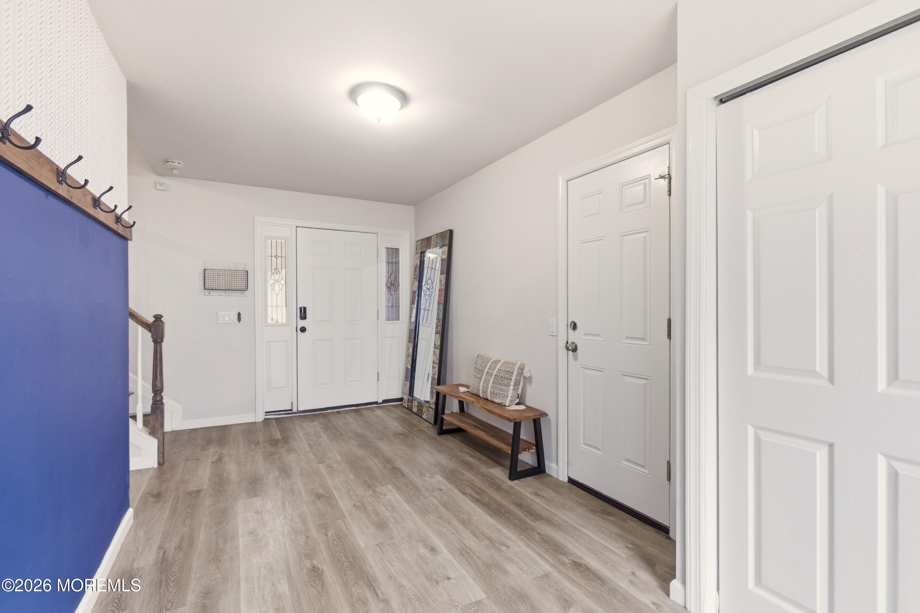 19 Silversmith Court Howell, NJ 07731 - Photo 29 of 48 a view of a room with wooden floor and a hallway