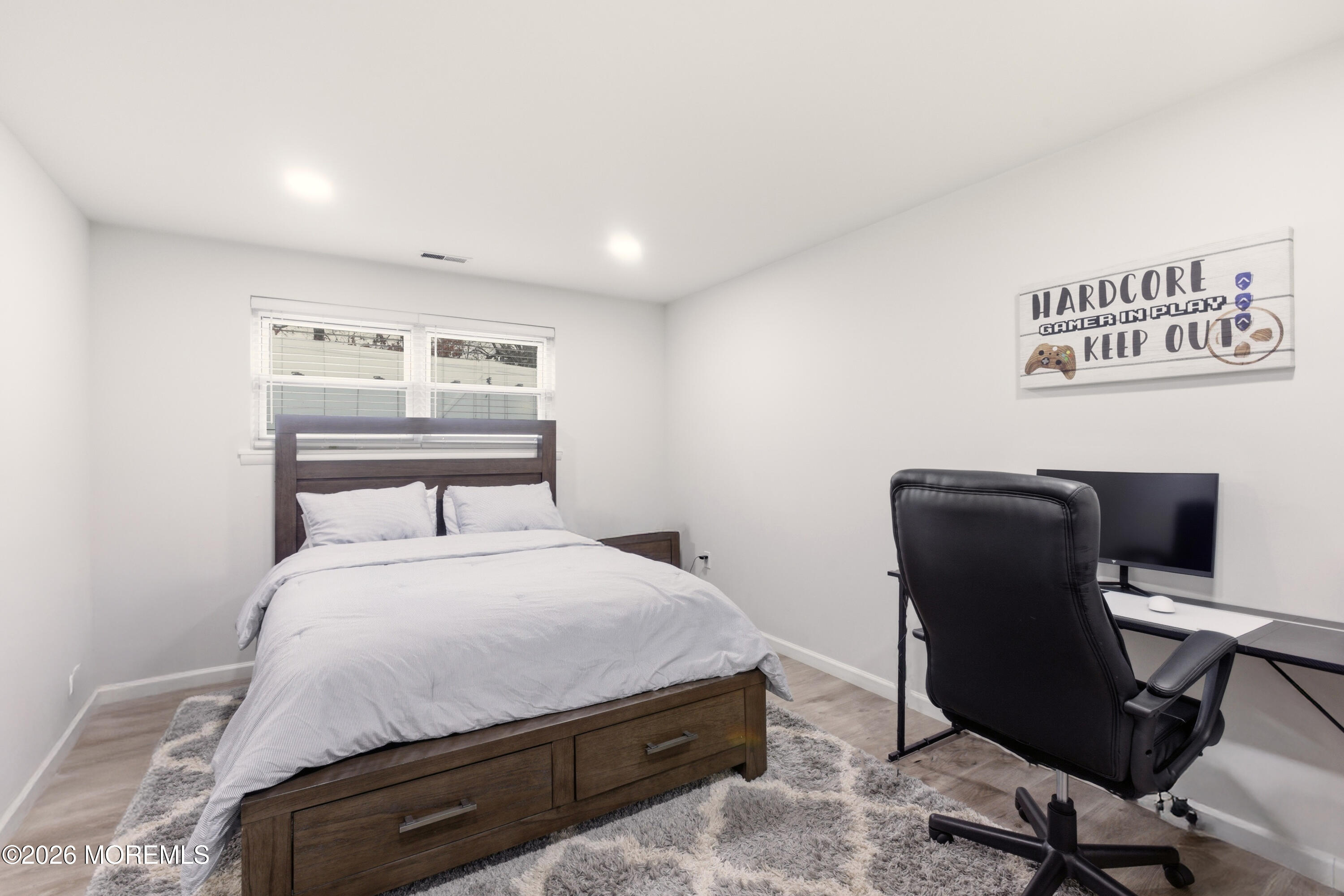 19 Silversmith Court Howell, NJ 07731 - Photo 30 of 48 a bedroom with a bed and chair
