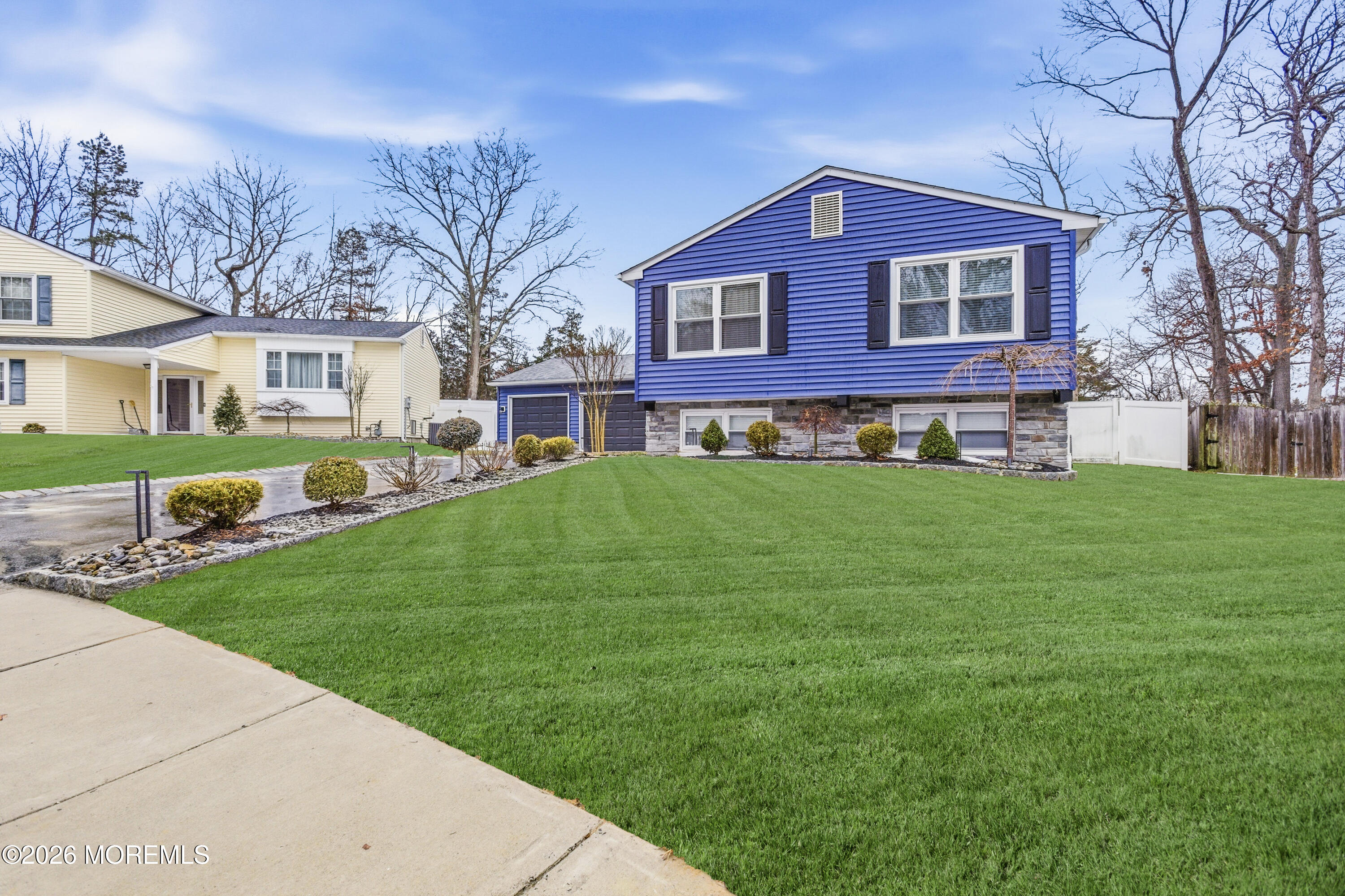 19 Silversmith Court Howell, NJ 07731 - Photo 3 of 48 a front view of a house with a garden