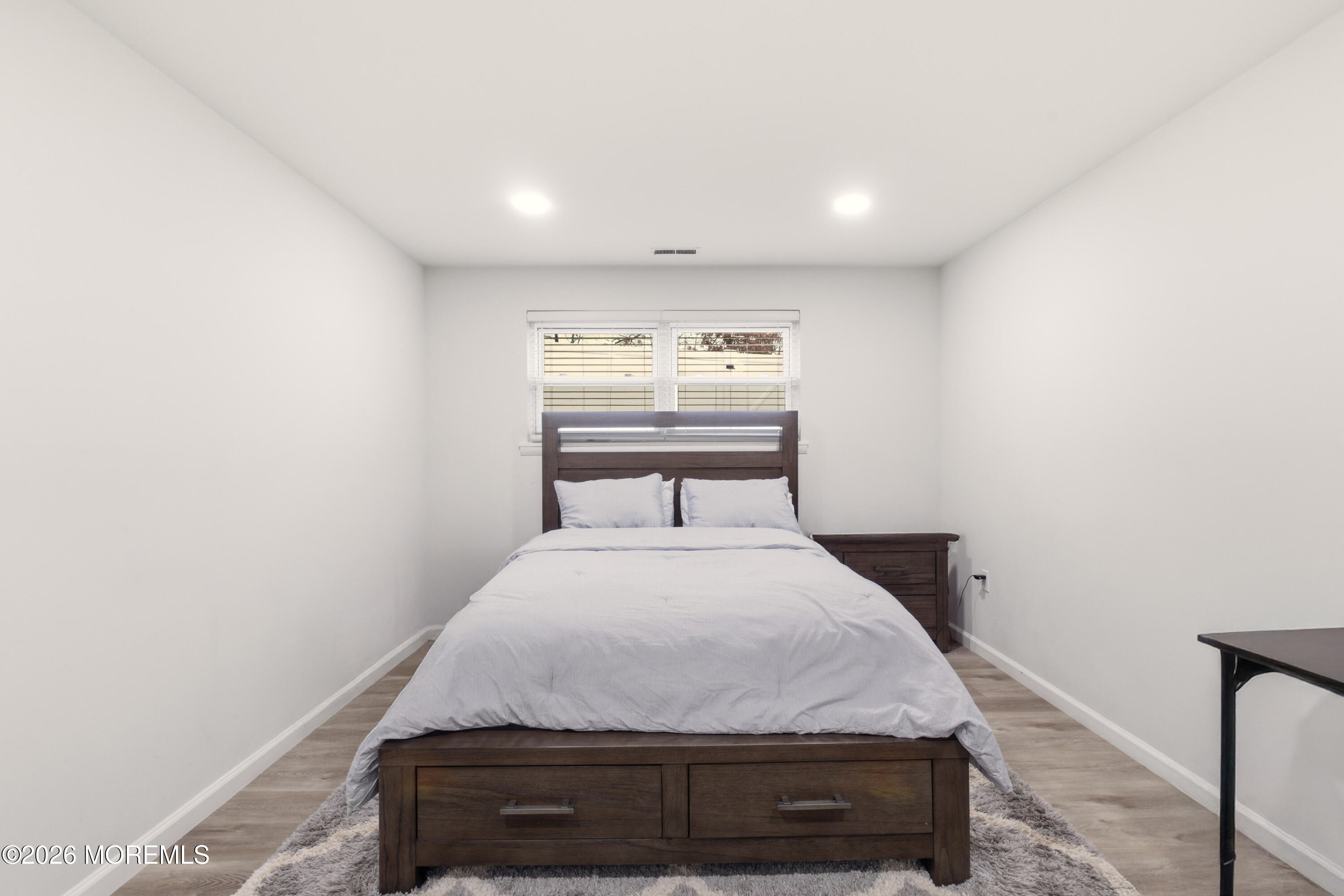 19 Silversmith Court Howell, NJ 07731 - Photo 32 of 48 a bedroom with a bed and window
