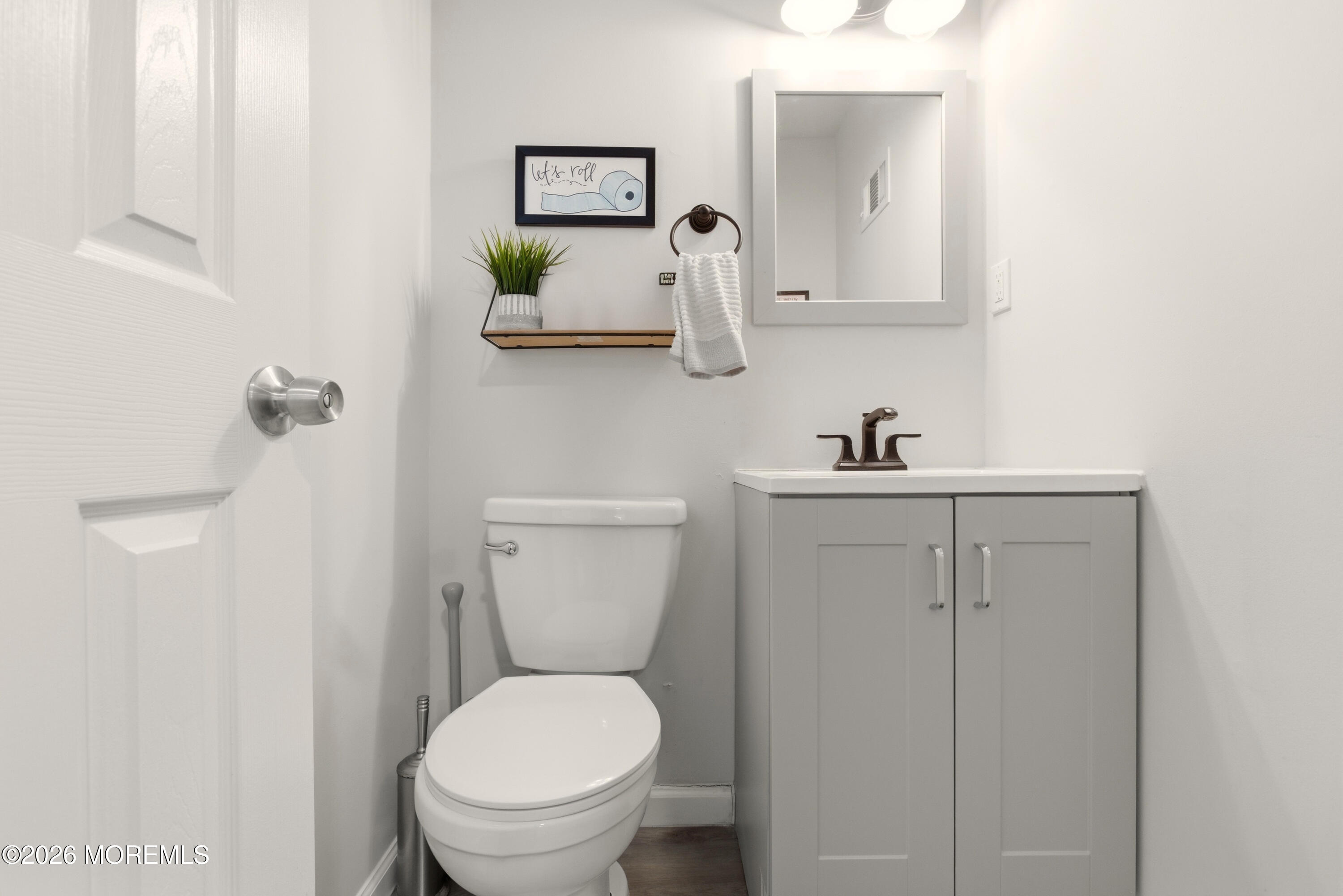 19 Silversmith Court Howell, NJ 07731 - Photo 34 of 48 a white toilet sitting next to a bathroom sink