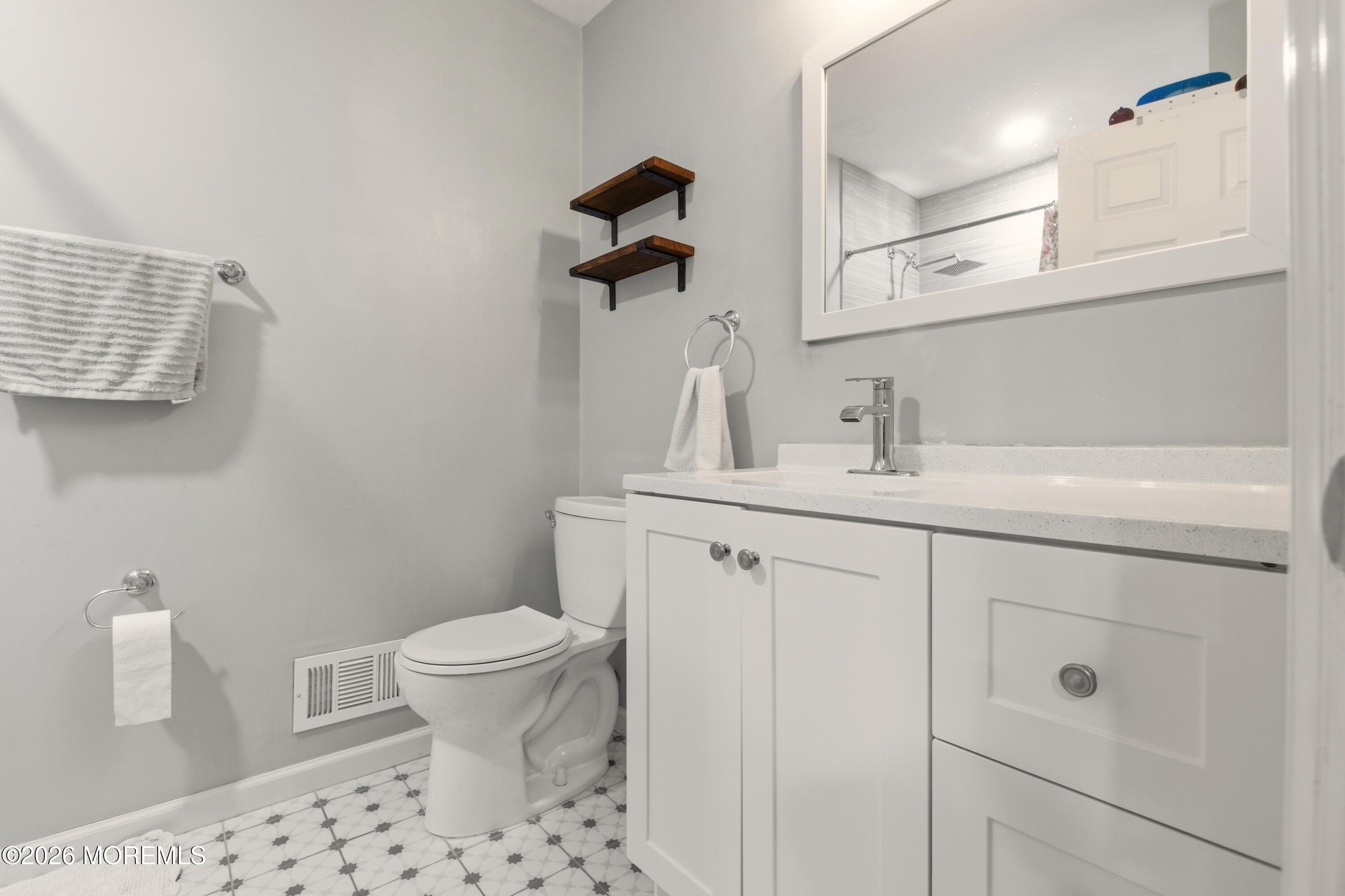 19 Silversmith Court Howell, NJ 07731 - Photo 35 of 48 a bathroom with a sink a toilet and shower