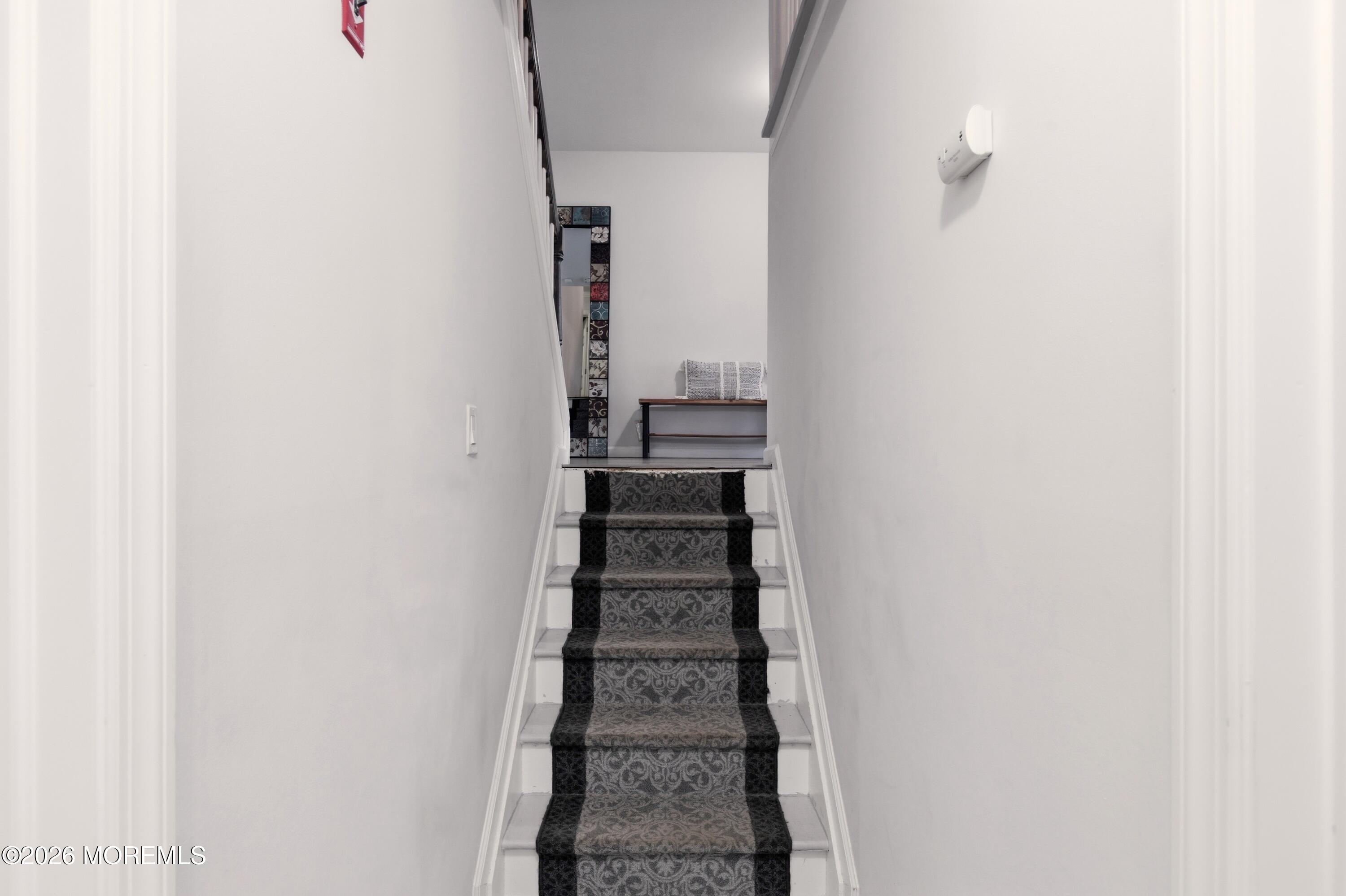 19 Silversmith Court Howell, NJ 07731 - Photo 37 of 48 a view of a staircase with white walls