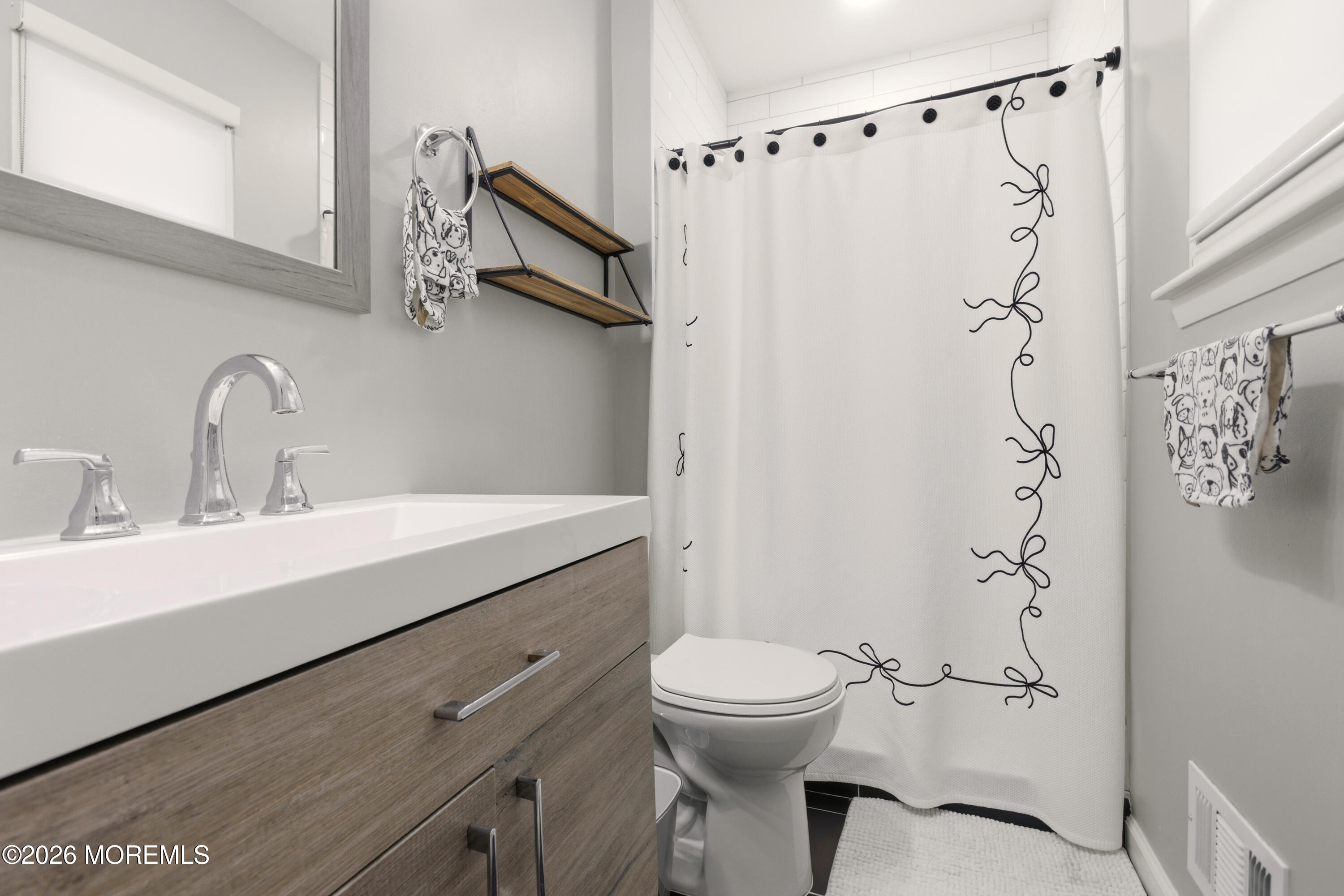 19 Silversmith Court Howell, NJ 07731 - Photo 39 of 48 a bathroom with a sink a toilet and shower