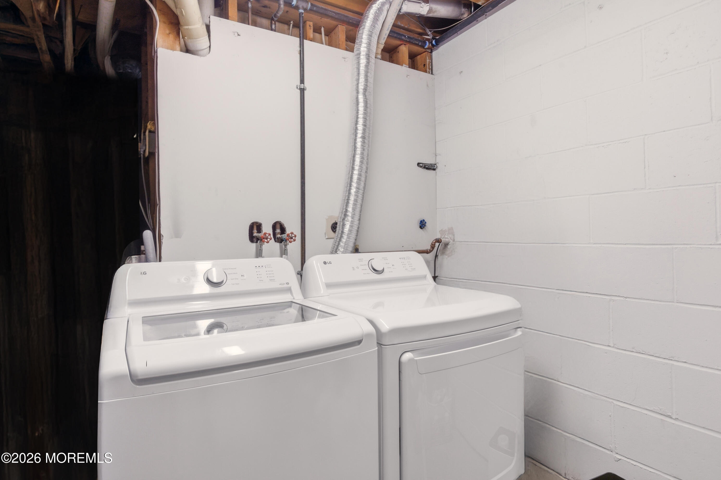 19 Silversmith Court Howell, NJ 07731 - Photo 41 of 48 a utility room with dryer and washer