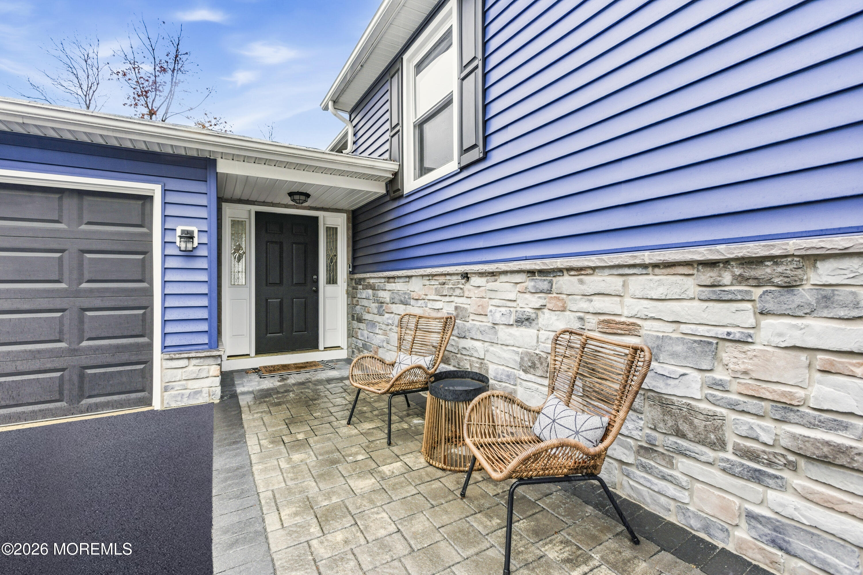 19 Silversmith Court Howell, NJ 07731 - Photo 7 of 48 a view of a patio with table and chairs and wooden floor