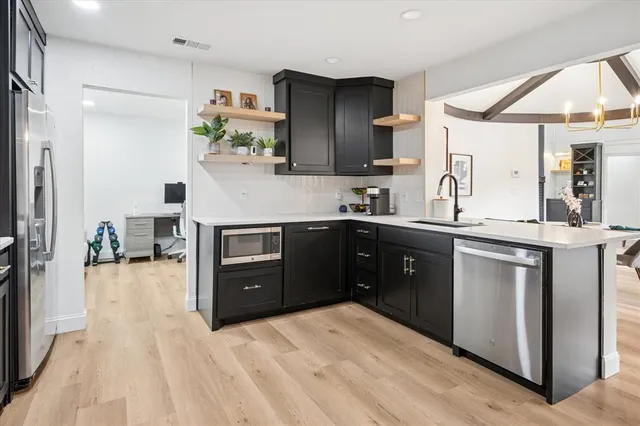 a kitchen with a sink and cabinets