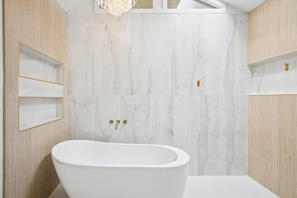 6030 Blue Mist Lane Dallas, TX 75248 - Photo 18 of 29 a white bath tub sitting next to a white toilet