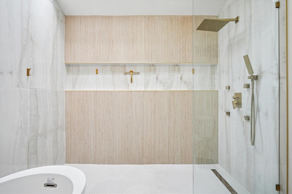 6030 Blue Mist Lane Dallas, TX 75248 - Photo 19 of 29 a bathroom with a bathtub and shower