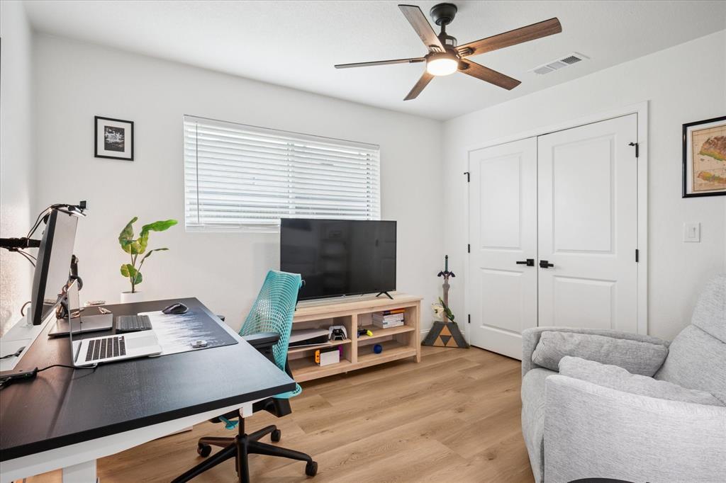 6030 Blue Mist Lane Dallas, TX 75248 - Photo 20 of 29 a living room with furniture and a flat screen tv